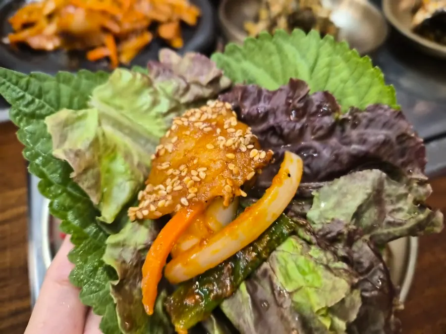 Pork stir-fry wrapped in leafy greens from the self-serve bar