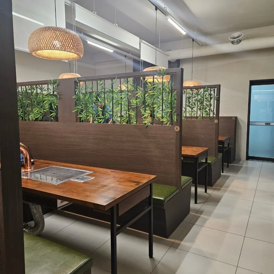 Wide tables and hall interior at Hwadamga