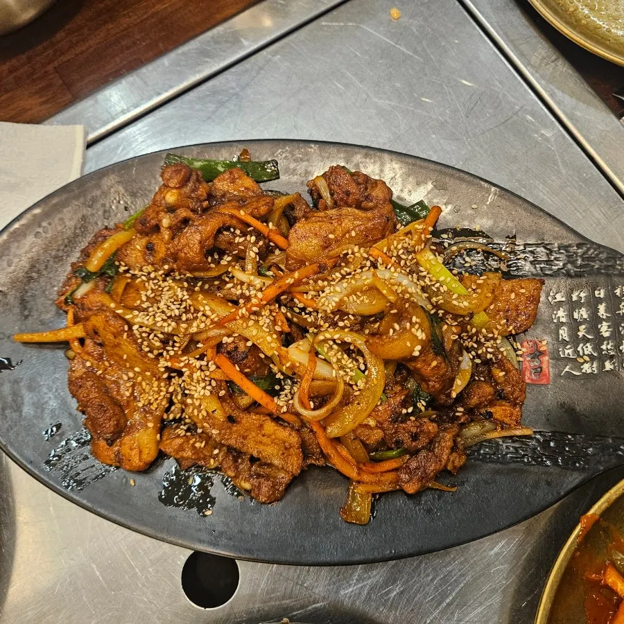 Fire-grilled pork stir-fry with smoky flavor