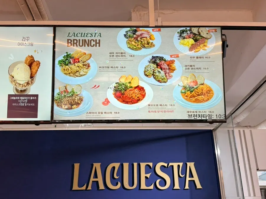Brunch menu board listing sandwiches, pasta, and platters