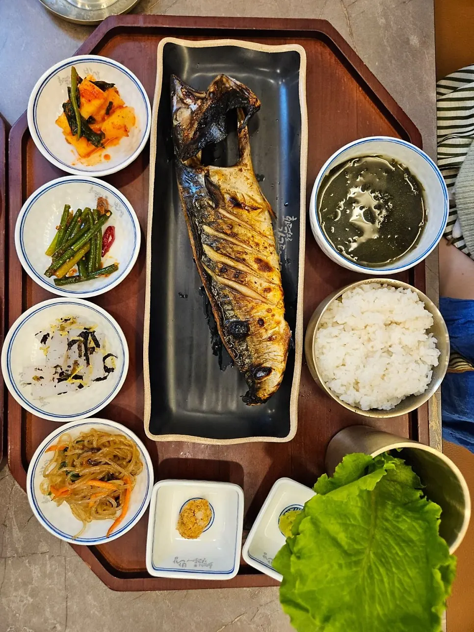 Grilled fish set meal on a tray with hotpot rice and seaweed soup