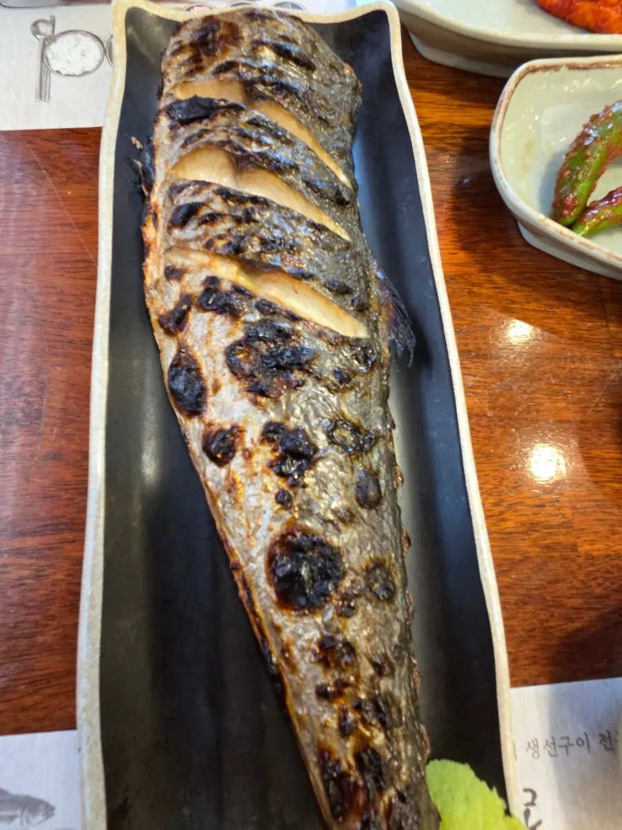 A large grilled Spanish mackerel fresh from the oven