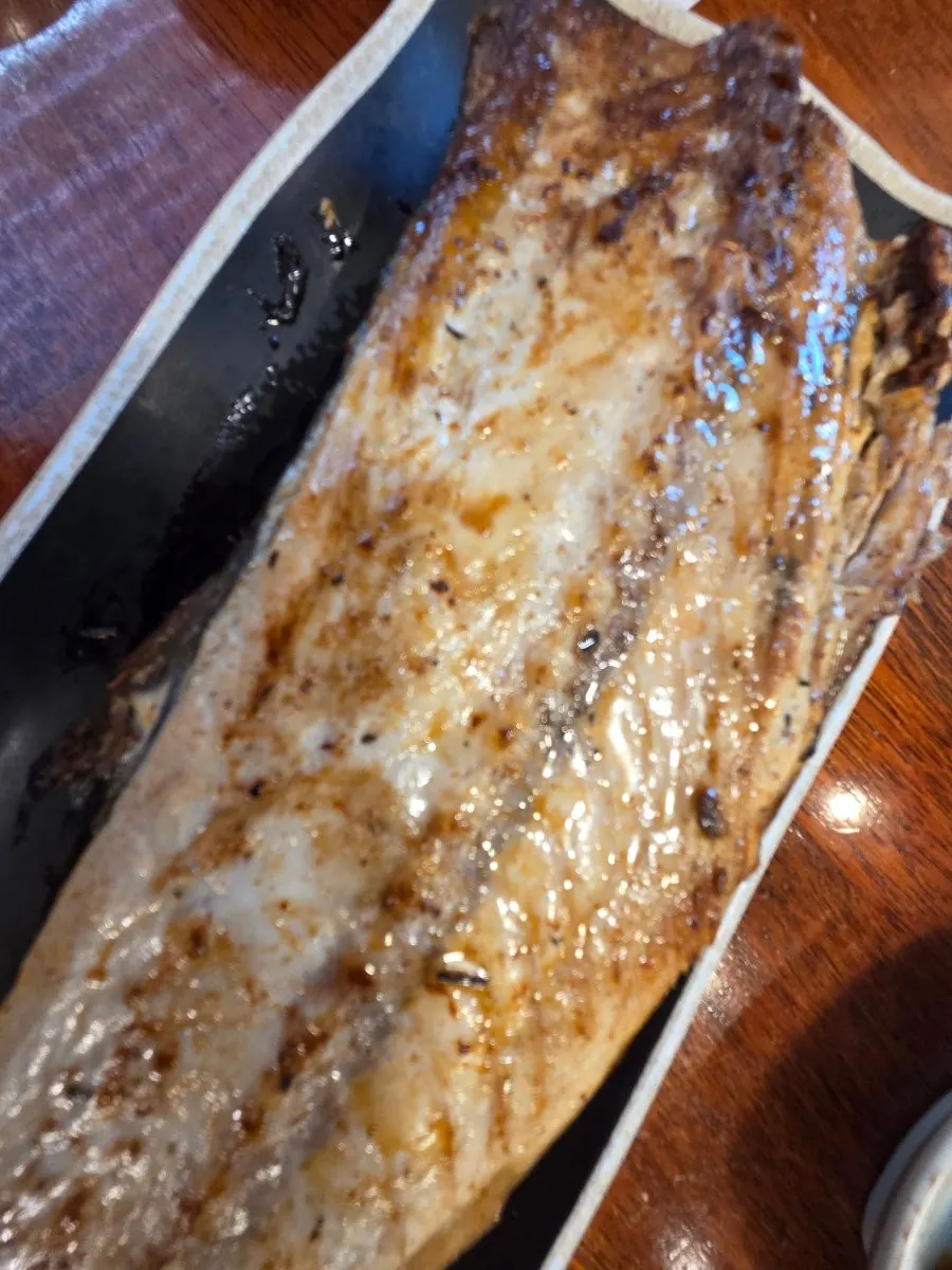 Close-up of the moist flesh inside the grilled fish