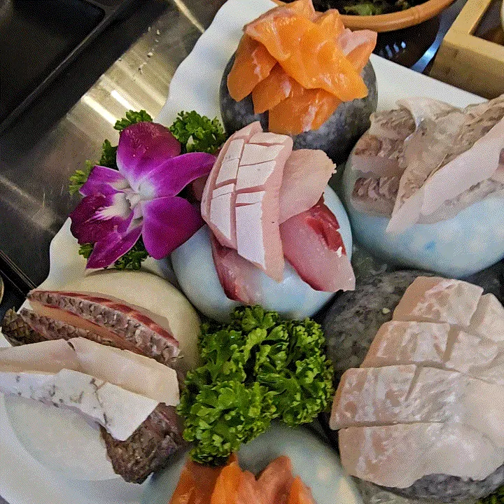 Seasonal assorted sashimi with salmon, flounder, sea bream, and yellowtail