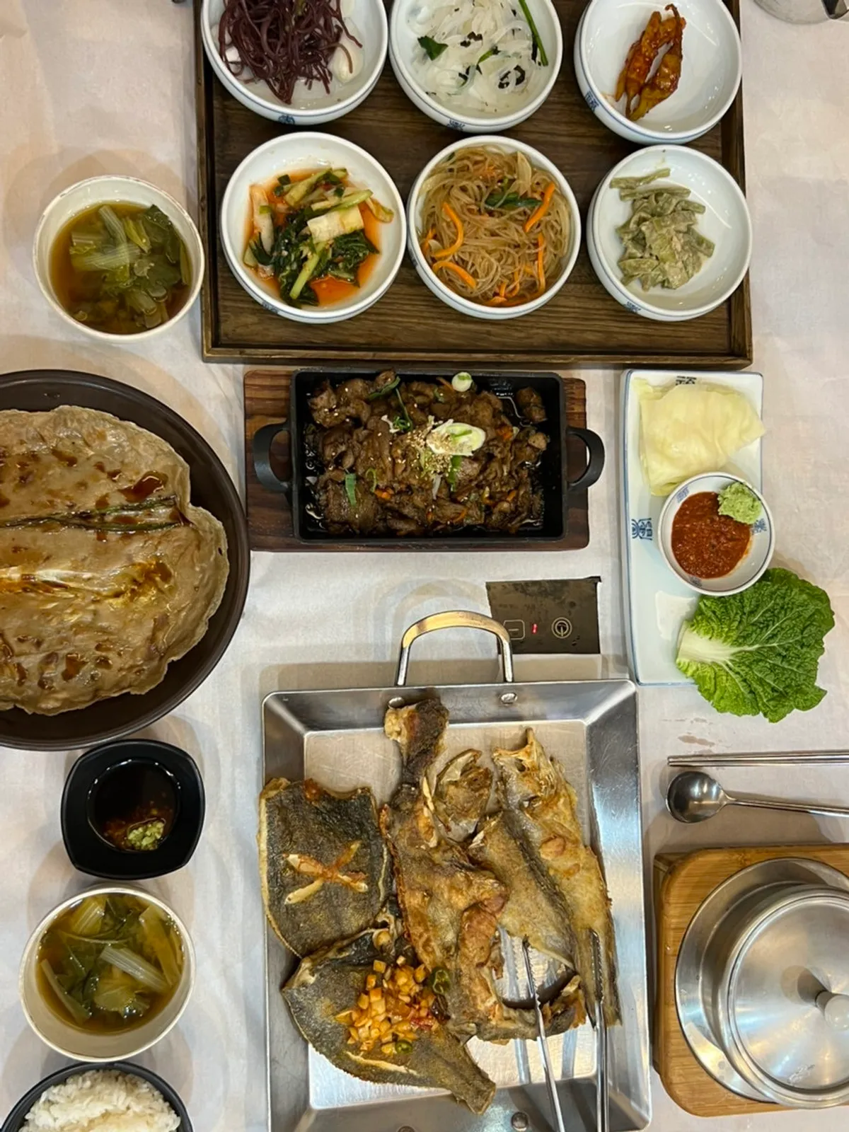 A family meal of grilled fish during the changing seasons