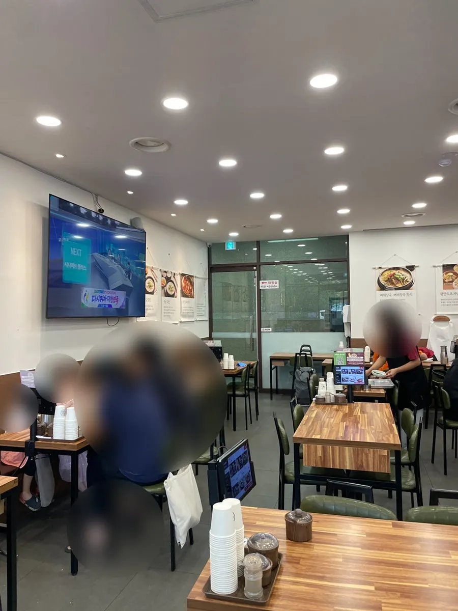 Seated at a table at Pyeongando Restaurant Hwajeong Branch