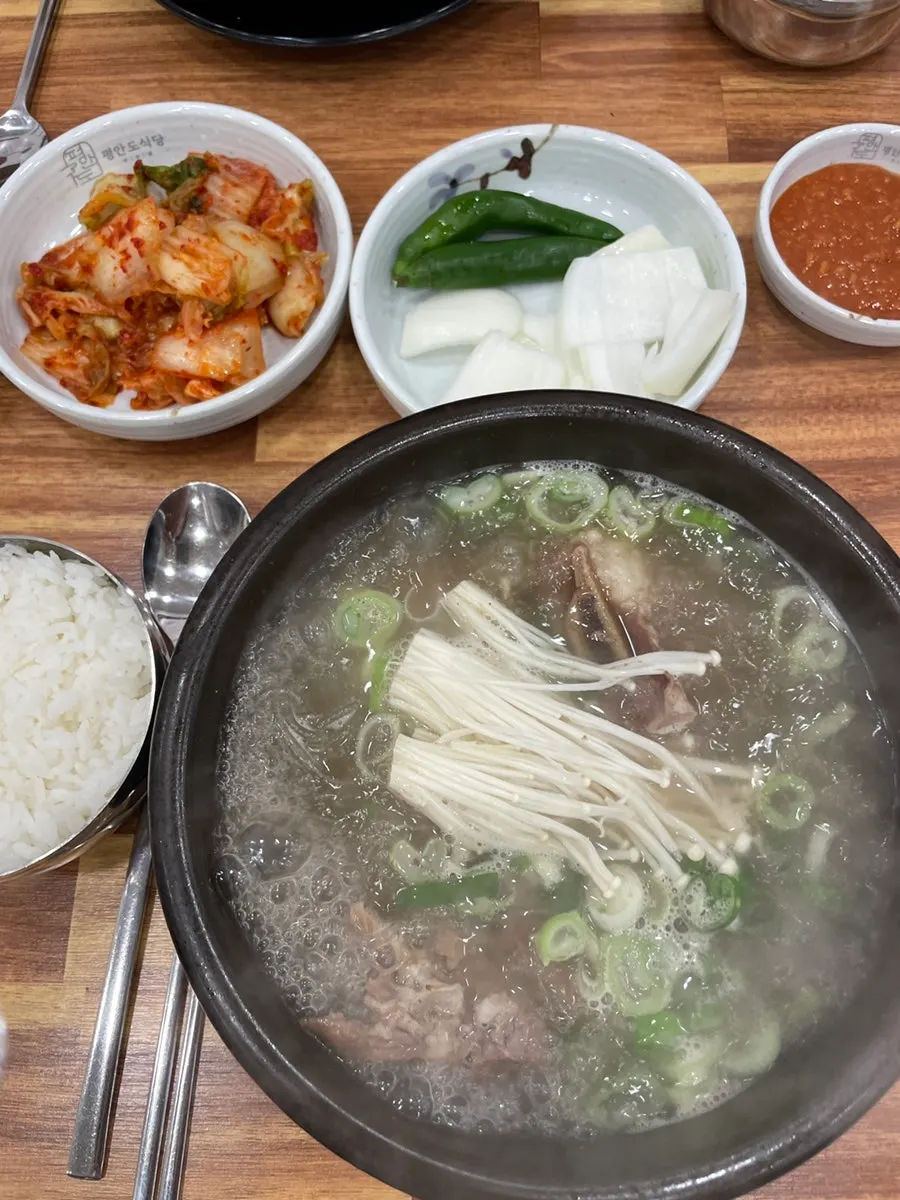 A hot stone pot of galbitang with steam rising