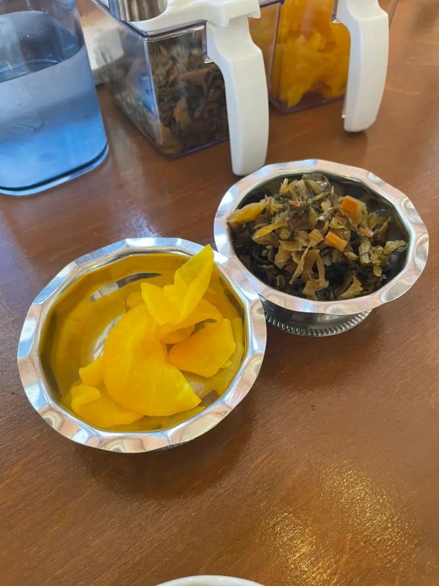 A neatly arranged plate of side dishes