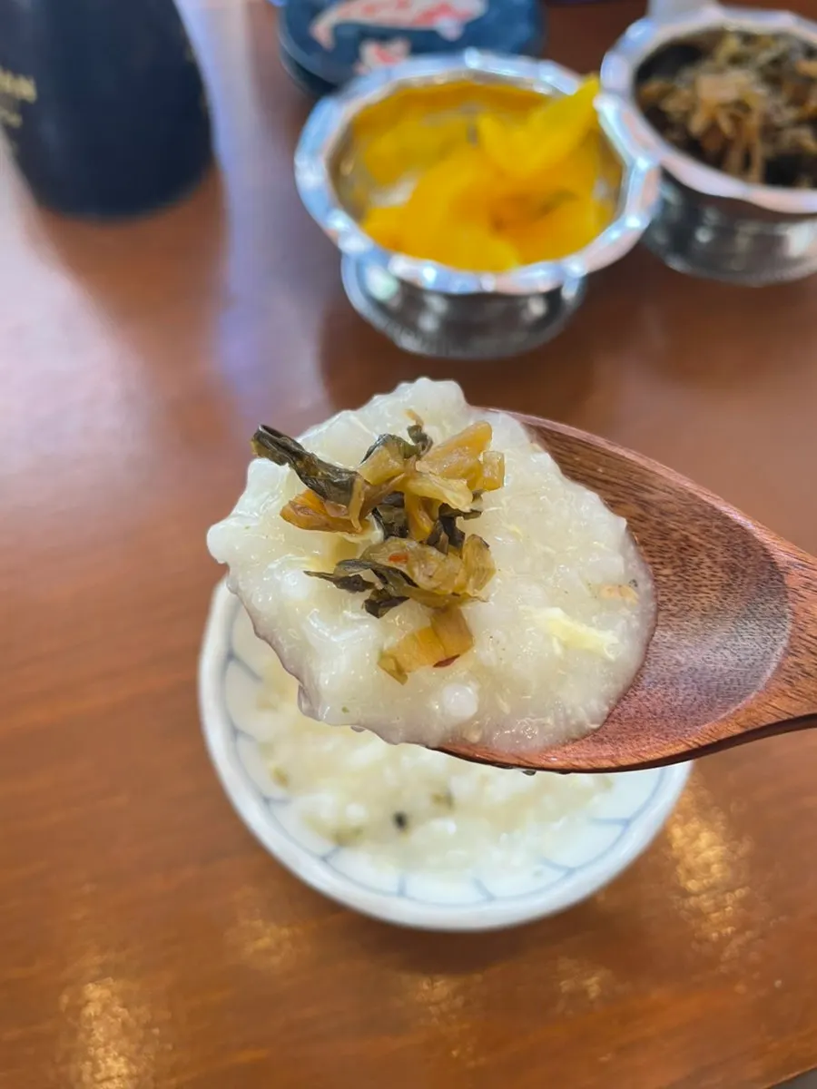 Egg porridge topped with a side dish