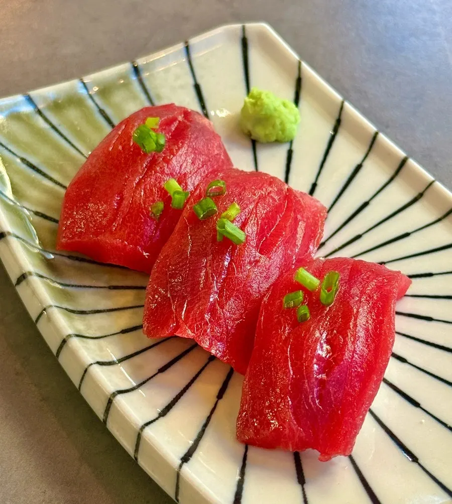 Three thick slices of tuna sushi