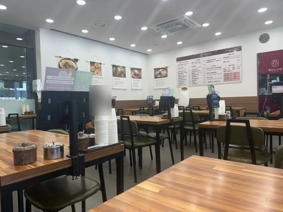 Clean interior seating at Pyeongando Restaurant Hwajeong Branch