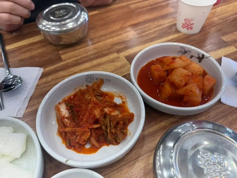 Plates of banchan (side dishes) on the table