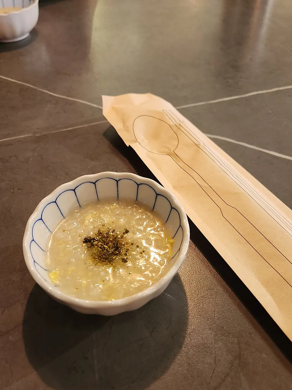 Warm rice porridge topped with furikake