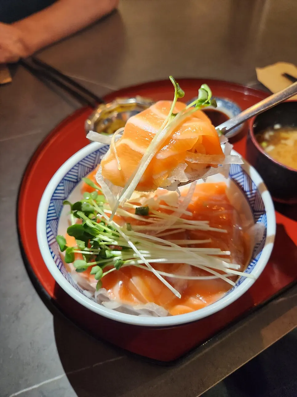Fresh salmon piled high over rice