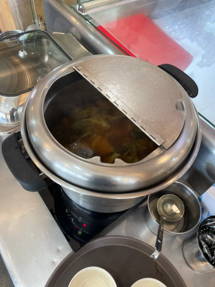Doenjang soup, wasabi, and soy sauce at the self-serve bar