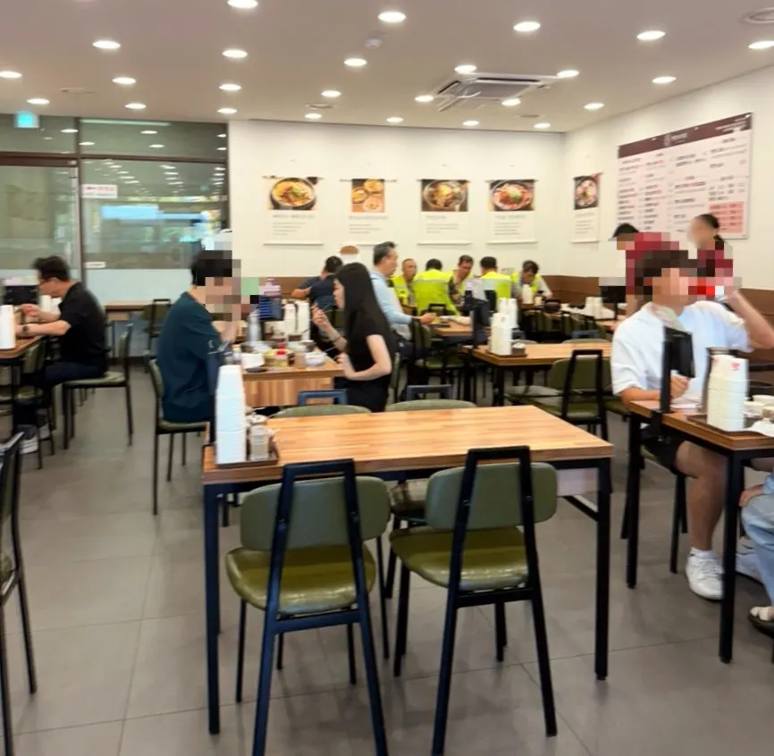 Busy lunchtime interior of Pyeongando Restaurant Hwajeong Branch
