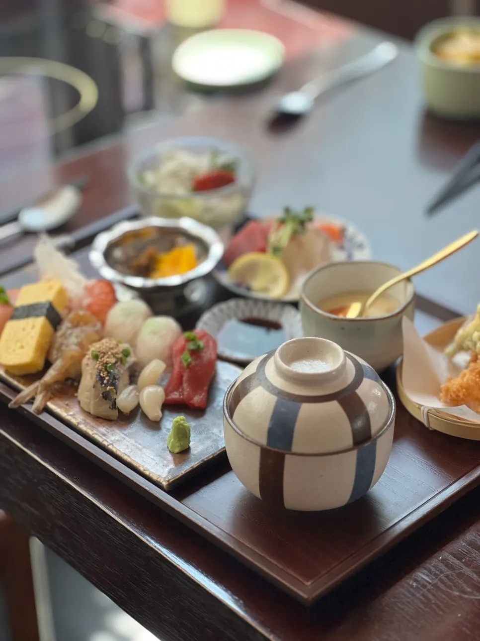 Sushi neta including flounder, sea bream, salmon, and tuna belly