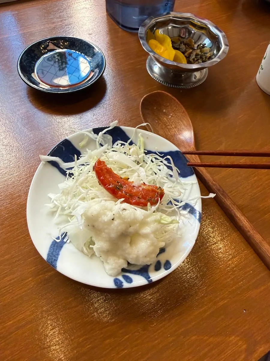 A bite of salmon with a spoonful of rice