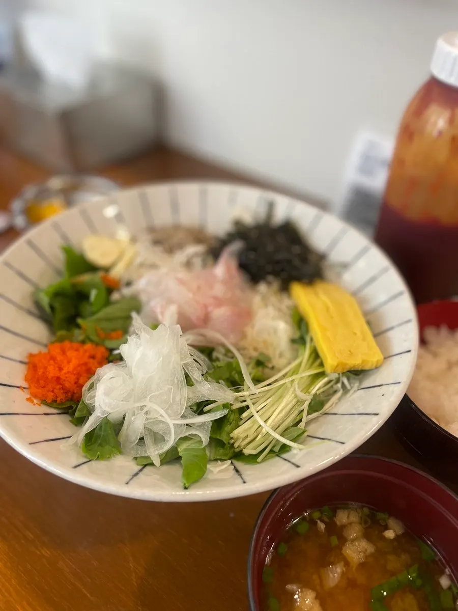 Vertical photo of a Japanese meal spread at Min Cook Misoyaki