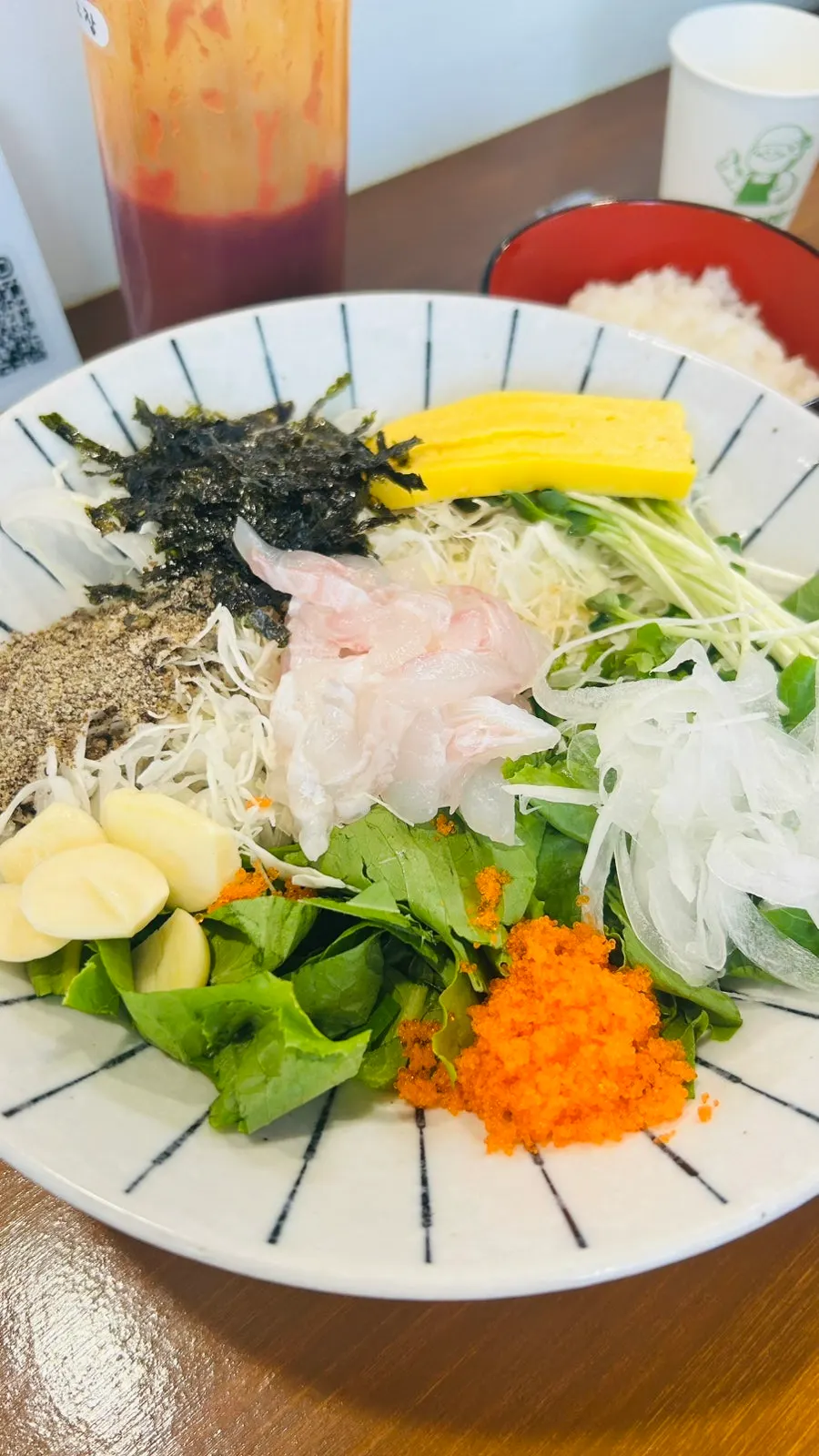 Flounder sashimi bowl piled high with vegetables