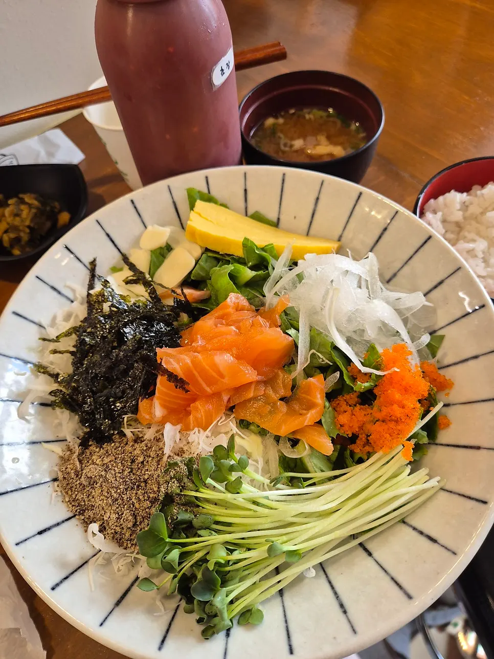 Grilled fish and salmon rice bowl spread at Min Cook Misoyaki