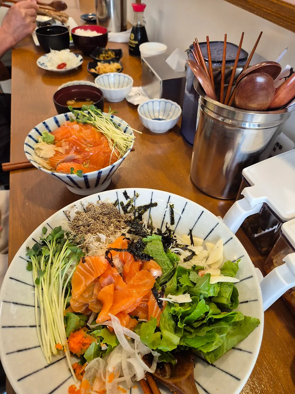 Table with miso-grilled mackerel and salmon bowl