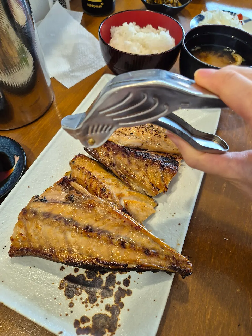 Lemon and squeezer served with the grilled mackerel