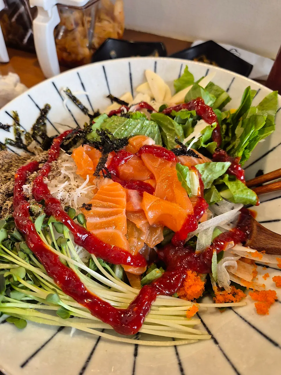 Salmon hoedeopbap drizzled with chojang sauce