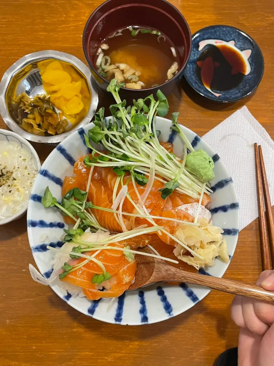 Eating the salmon rice bowl
