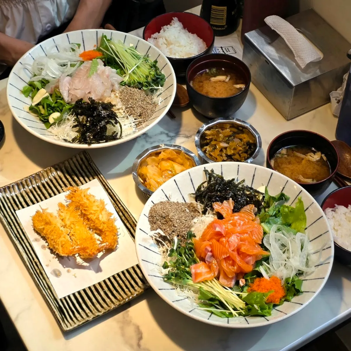 Flounder and salmon hoedeopbap set together on the table