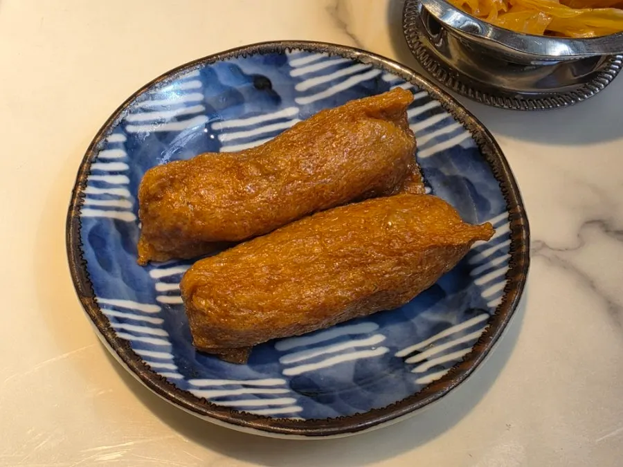 A plate of inari sushi ordered as a side