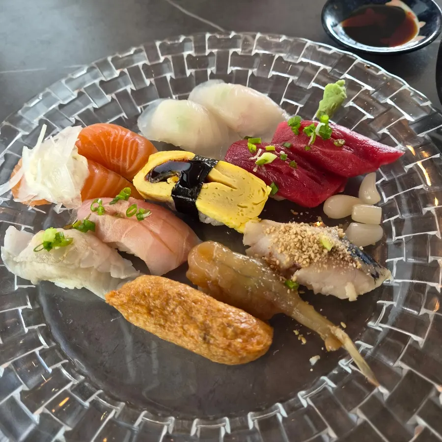 Assorted sushi in varied colors including salmon and tuna