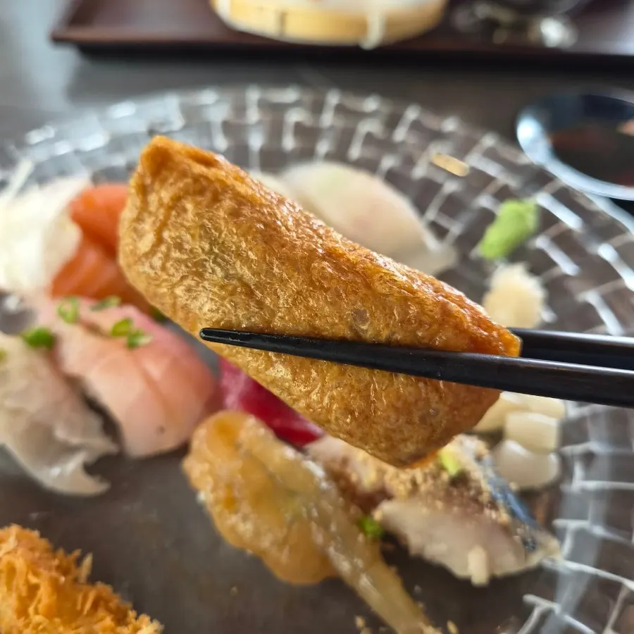 Inari sushi fully wrapped in fried tofu