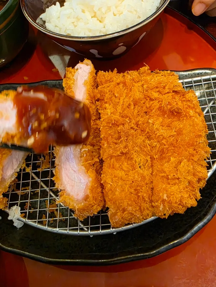 Crispy pork cutlet dipped in sauce