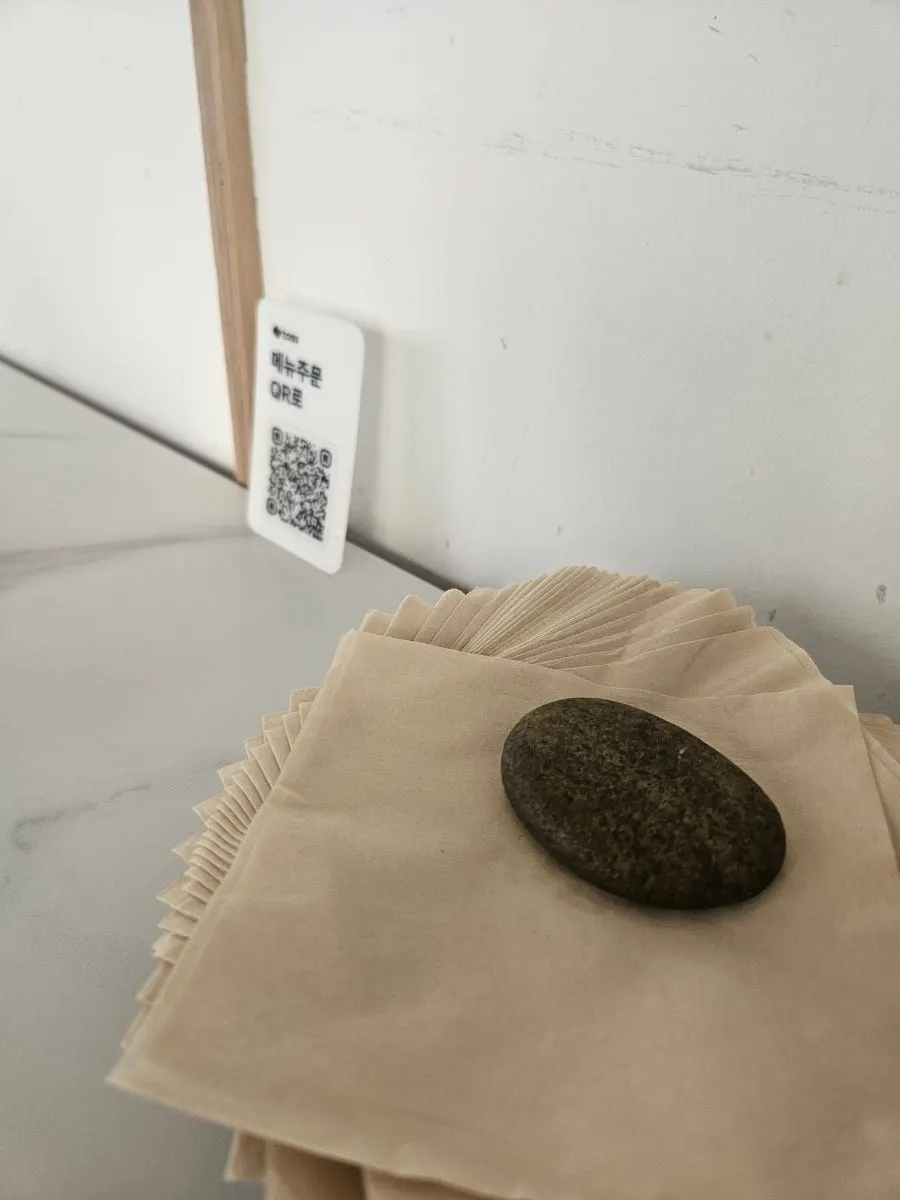 Tablet and QR code ordering setup on the table
