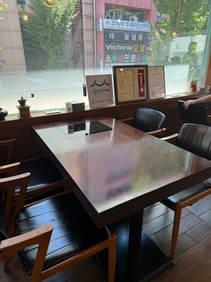 Spacious main dining hall at Min Cook Dasima with many tables