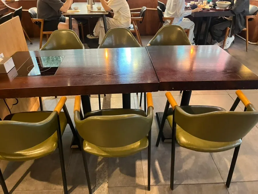Long window seating with trees visible outside