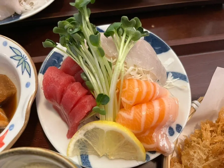 Thick-cut salmon, tuna, and white fish sashimi