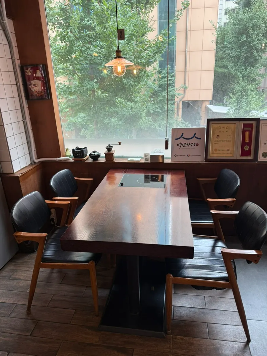 Interior of Min Cook Dasima with floor-to-ceiling windows
