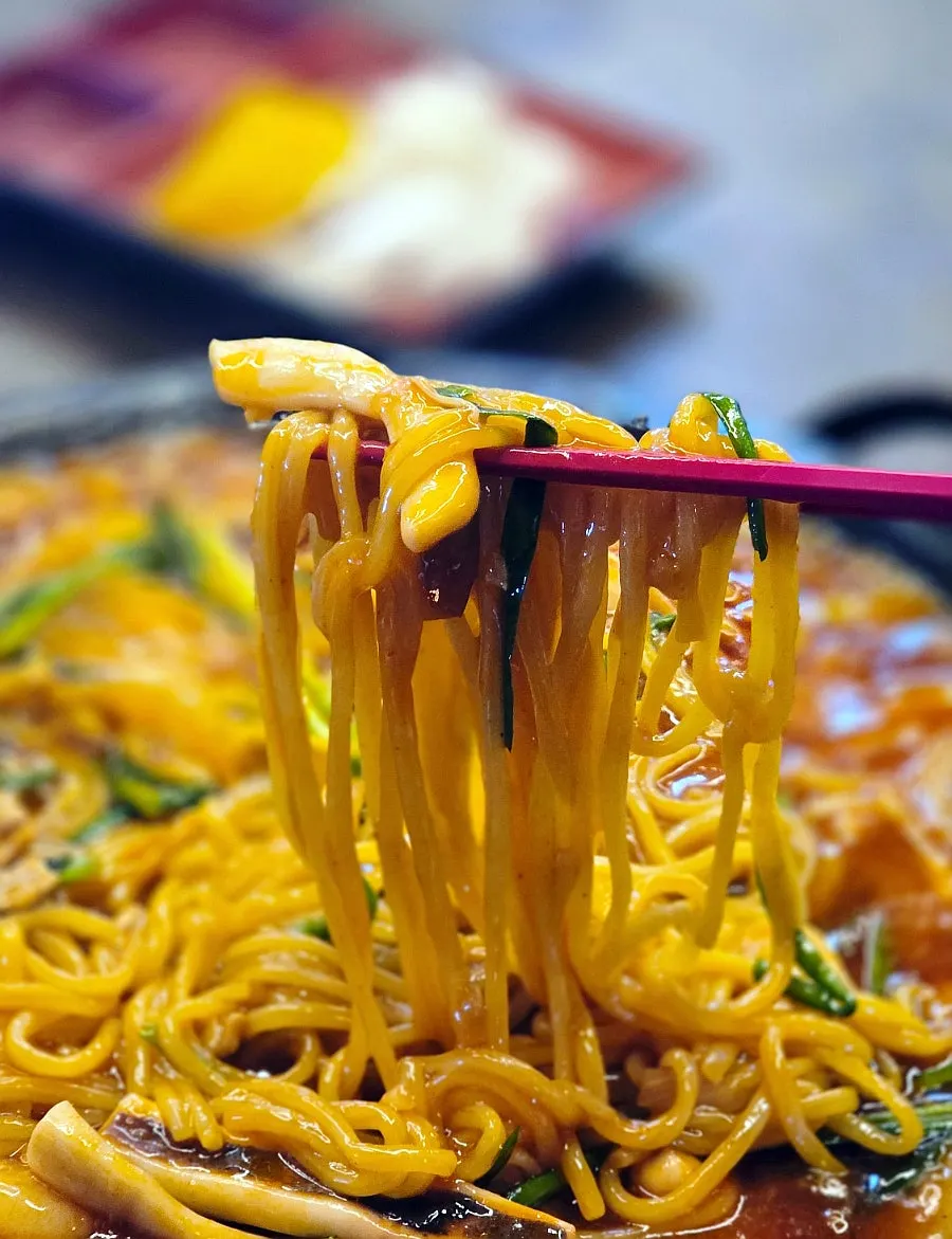 Whole squid coated in sauce with thick sauce base