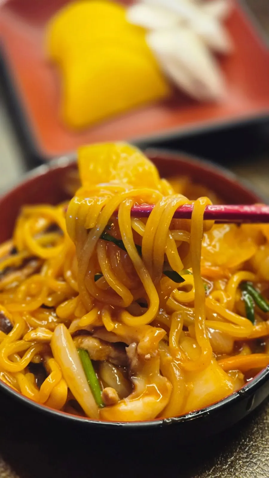 Close-up of sauce-coated noodles
