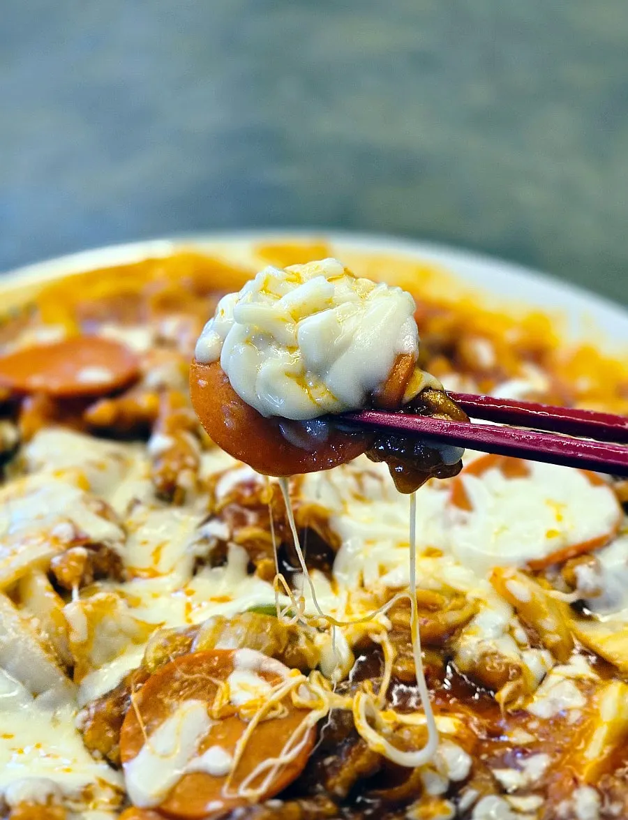 Stretchy cheese pull on kimchi pizza tangsuyuk