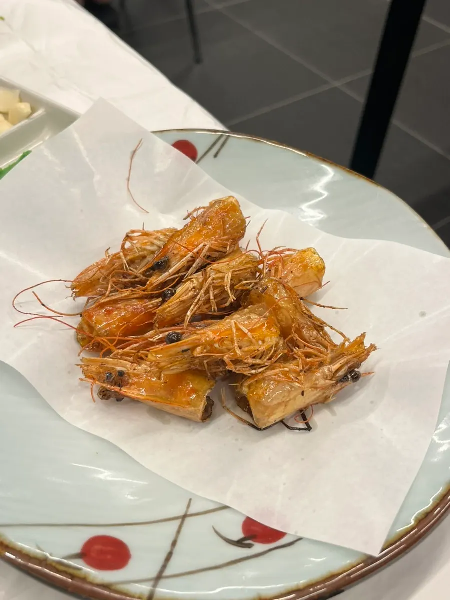 Crispy fried shrimp heads served hot