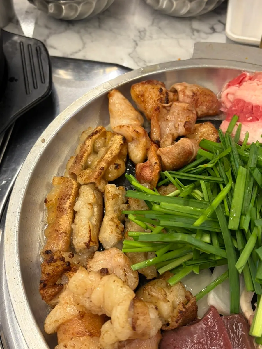 Grilled daechang paired with aged kimchi