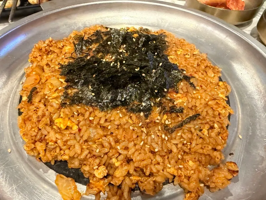 A piece of gopchang piled high with chives