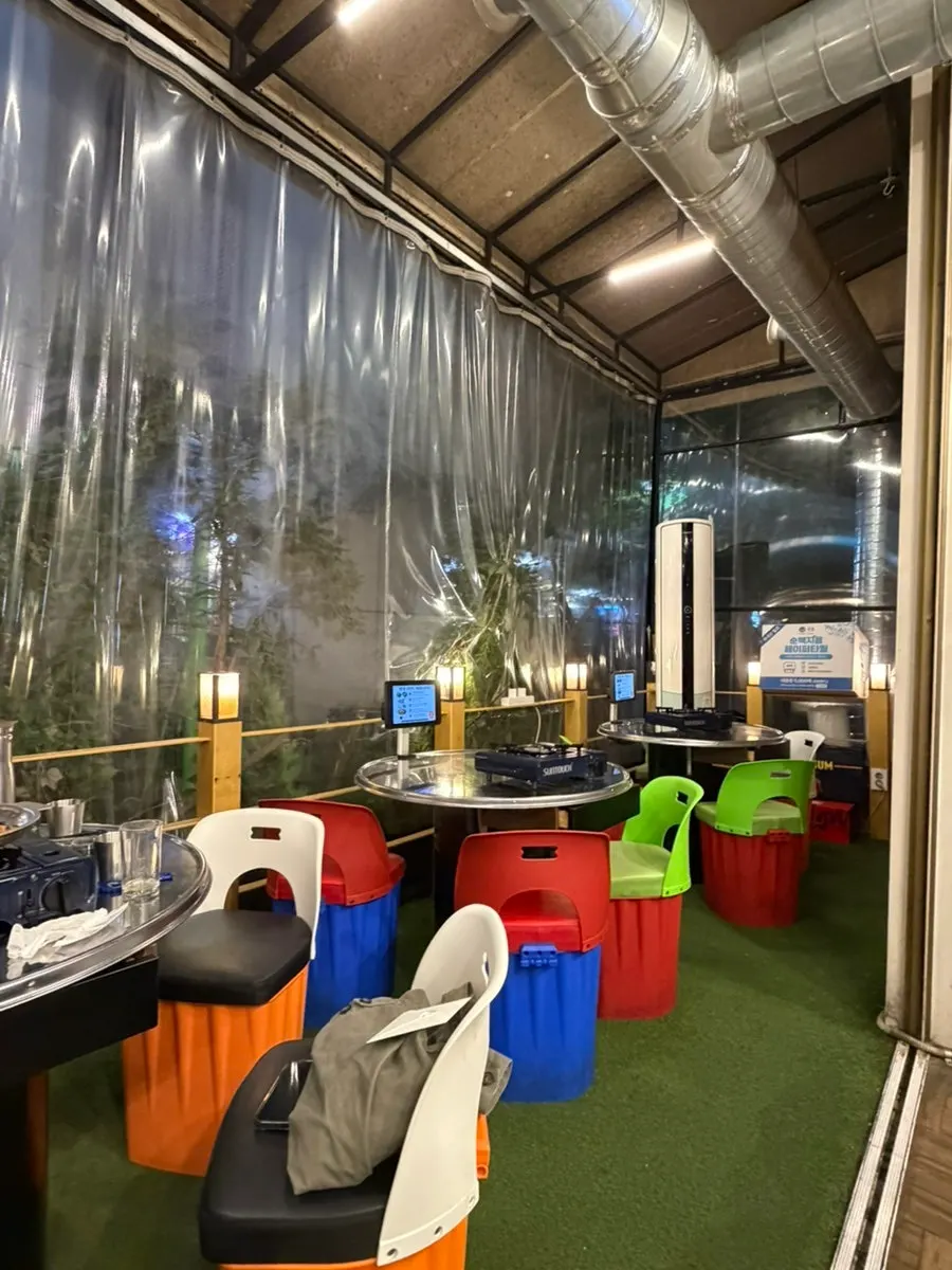 Entrance of Hwang Gop with doors wide open for tent-bar atmosphere