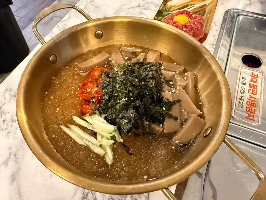 A plate of domestic yukhoe (beef tartare) tasting portion