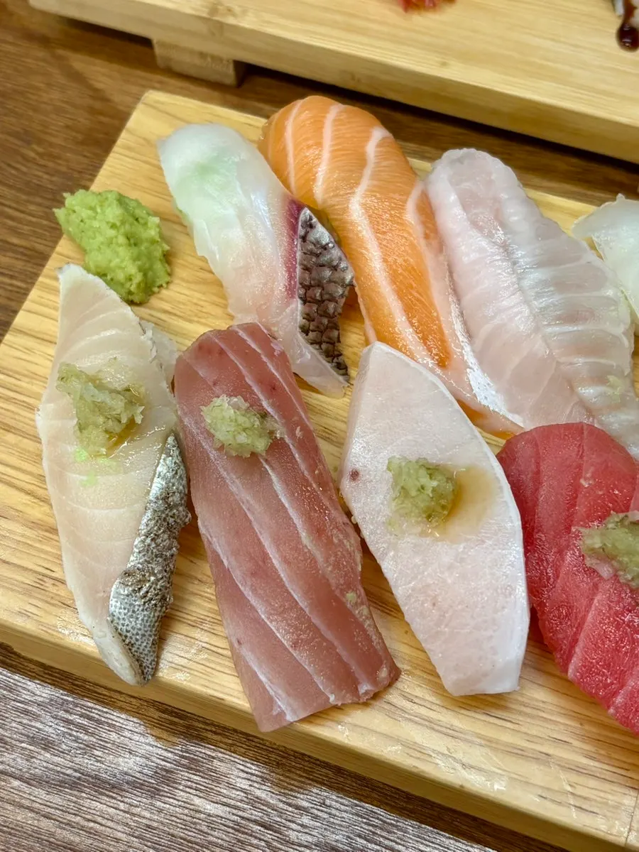 Flounder topped with aged kimchi and sea bream sushi