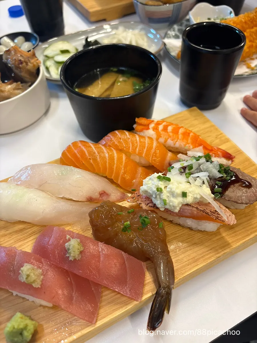 A piece of grilled beef sushi