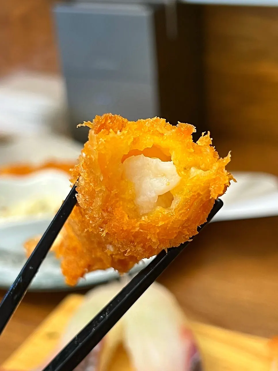 Holding a piece of king shrimp tempura